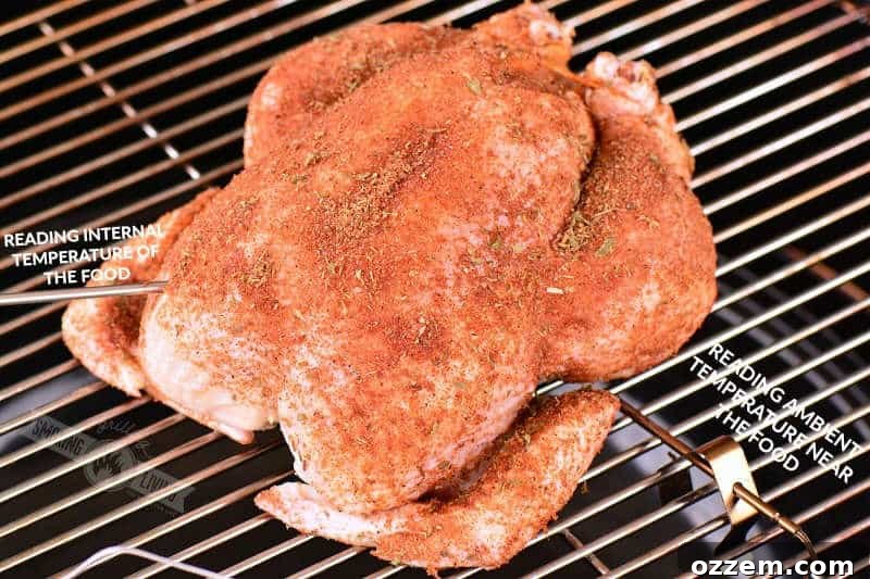 raw chicken coated with dry rub on the grill grate