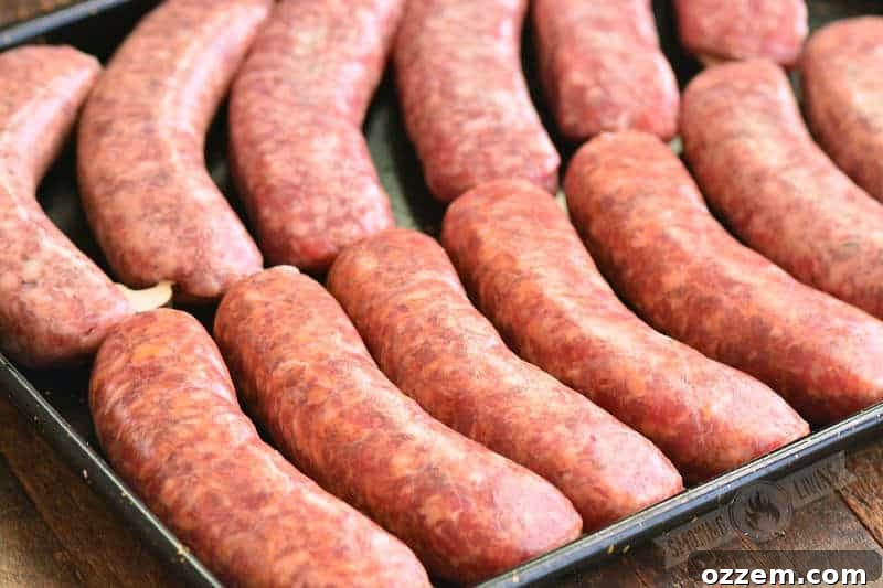 raw sausage on the baking sheet