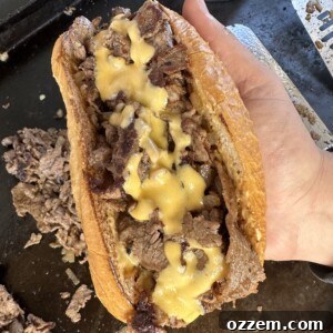 Completed Philly Cheesesteak sandwich with melty cheese
