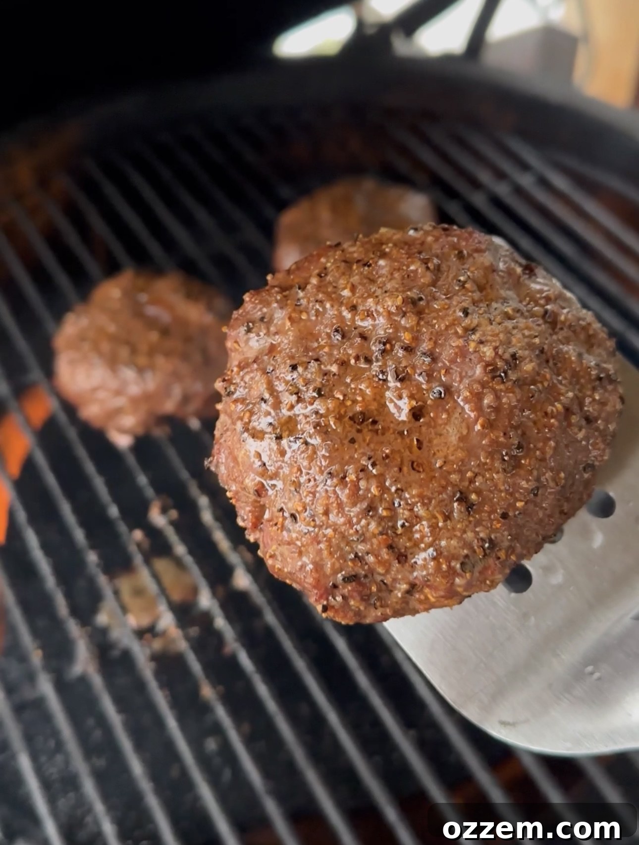 Juicy grilled beef patty with grill marks