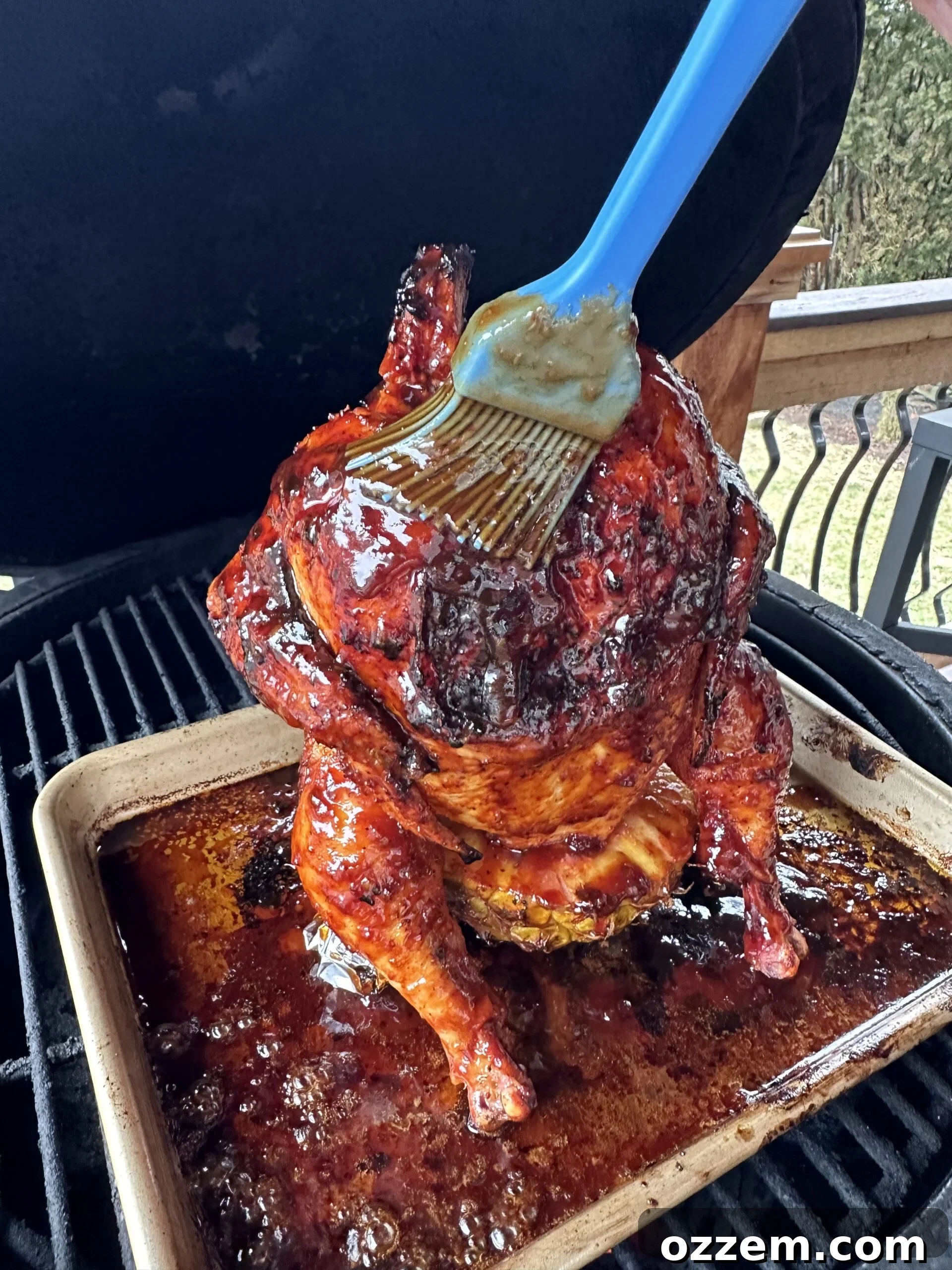 Huli Huli sauce being applied to chicken. 