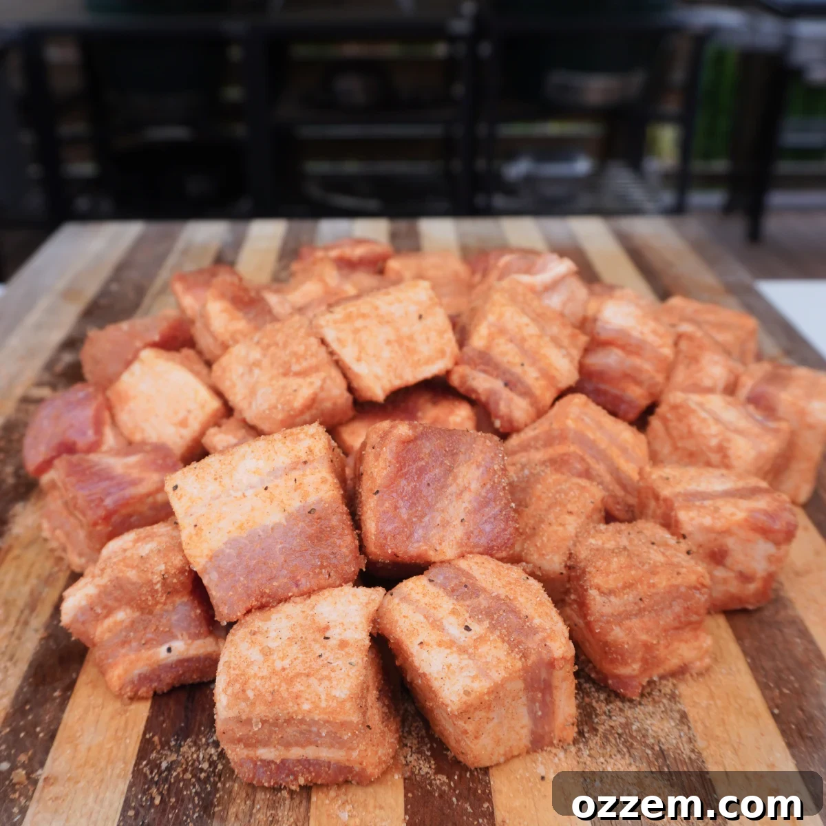 Seasoned pork belly cubes coated with rub.