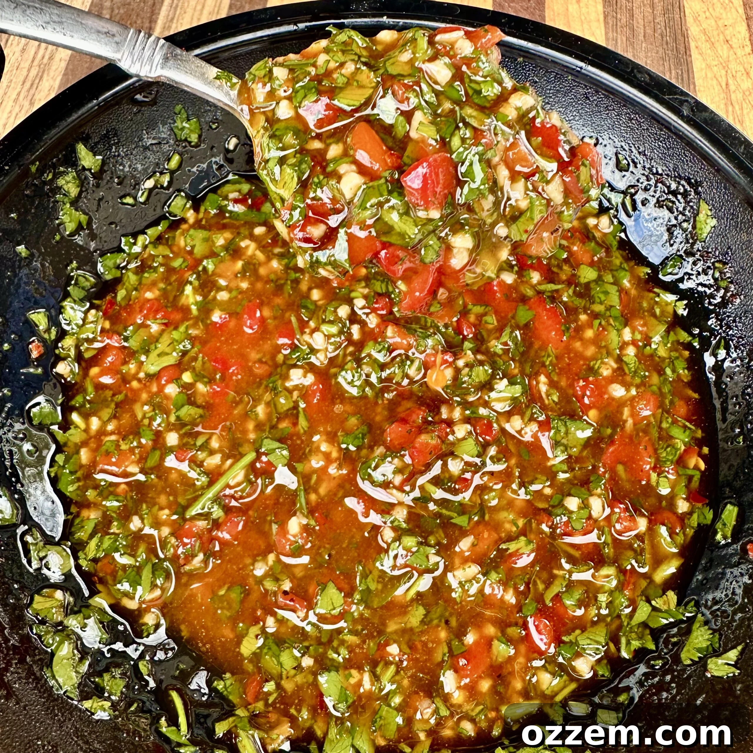 Close-up of freshly made Red Chimichurri Sauce in a bowl.