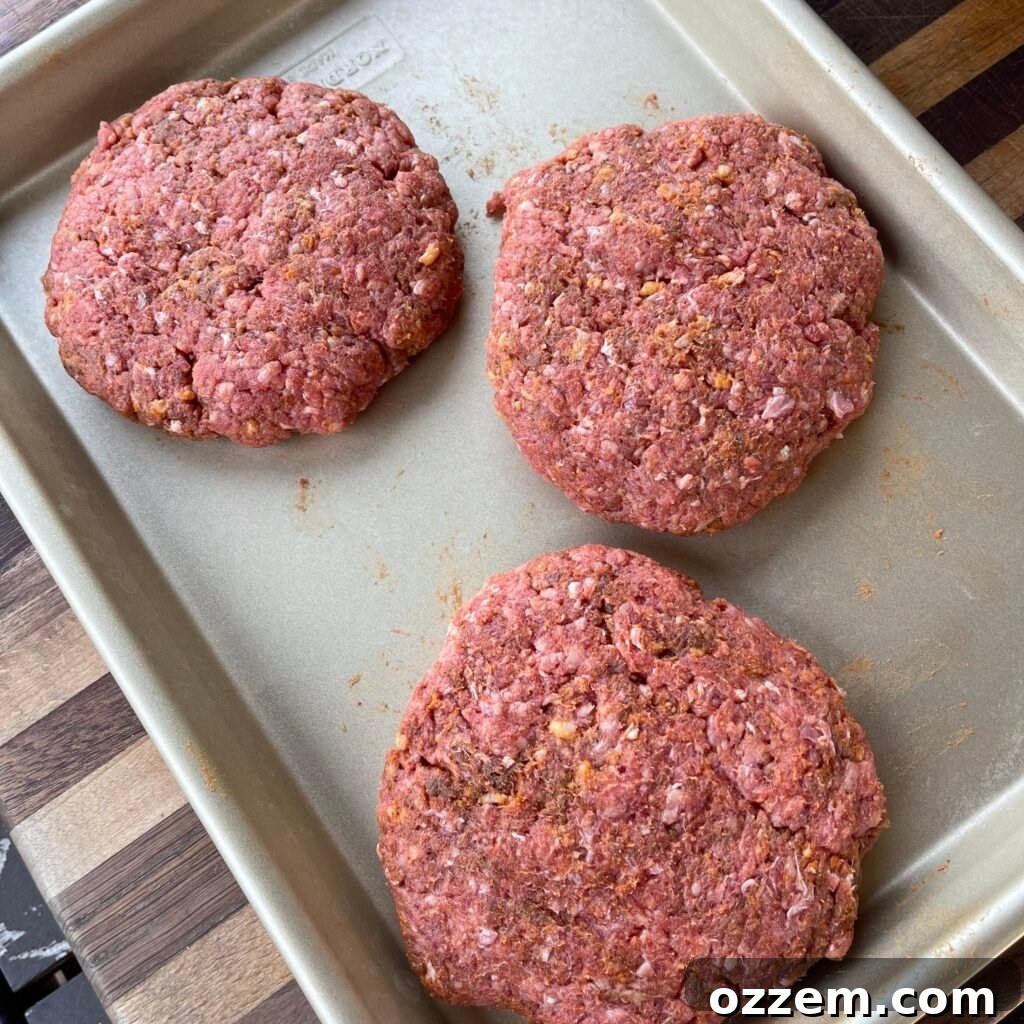 Raw homemade Salisbury steak patties waiting to be cooked.