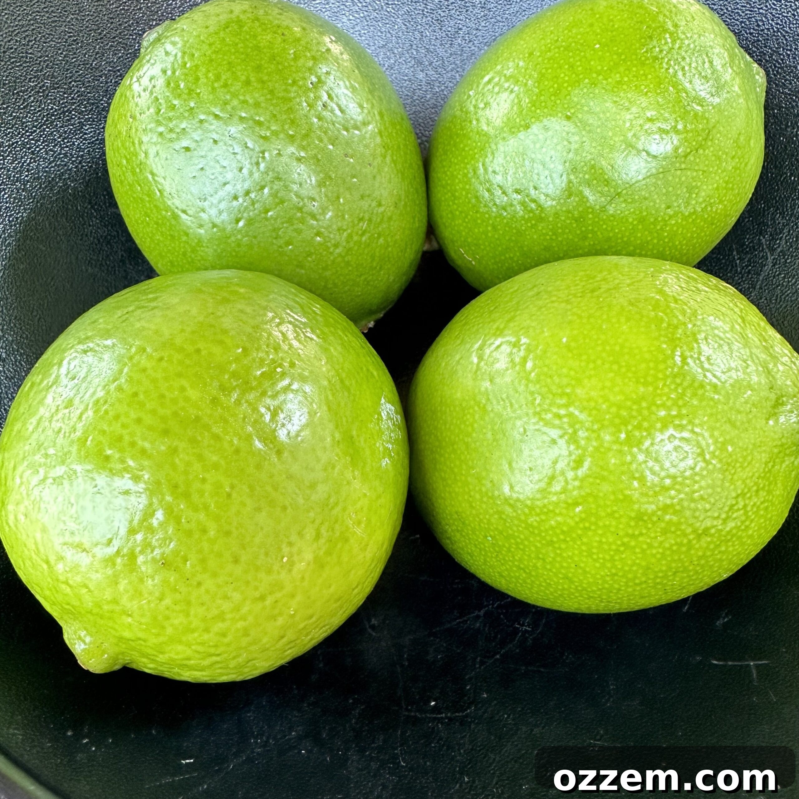 Fresh, vibrant green limes ready to be transformed into delicious Brazilian Lemonade.
