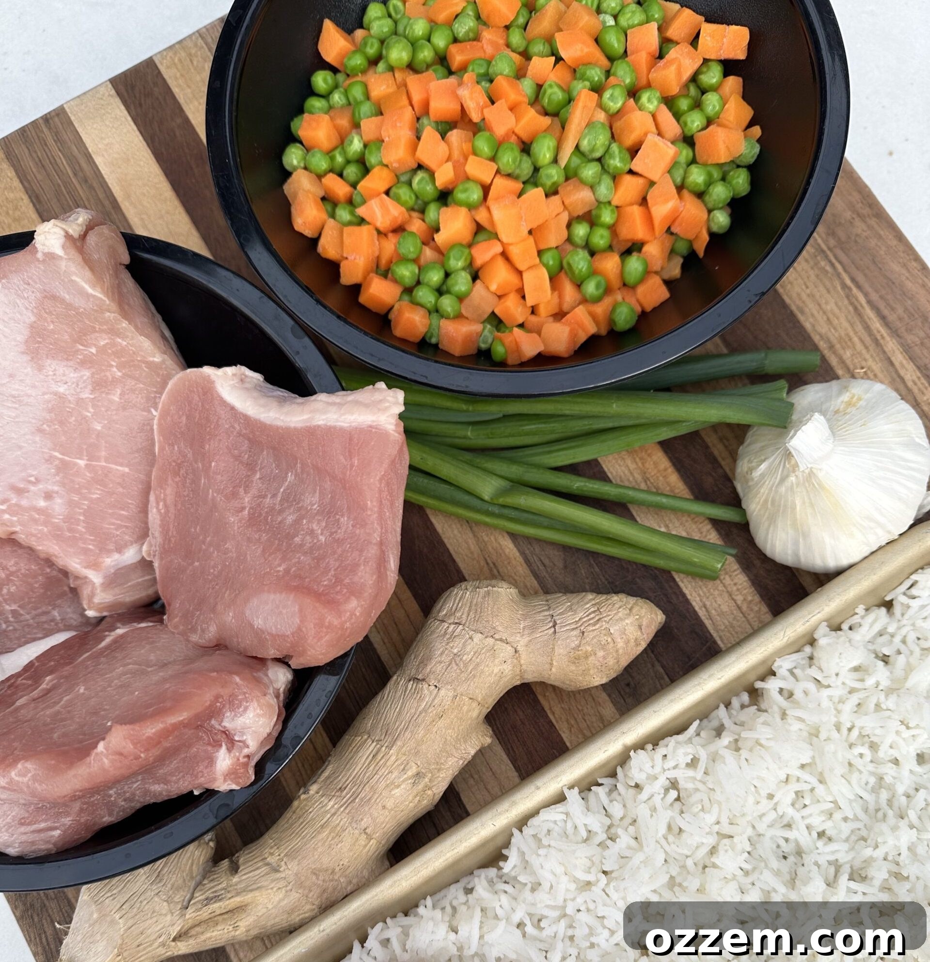 Ingredients for BBQ pork fried rice including pork, rice, and vegetables