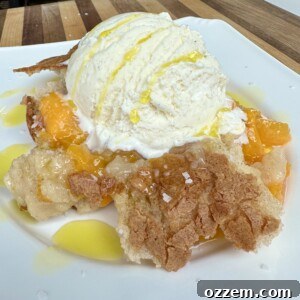 Beautifully golden-brown grilled peach cobbler ready to be served.
