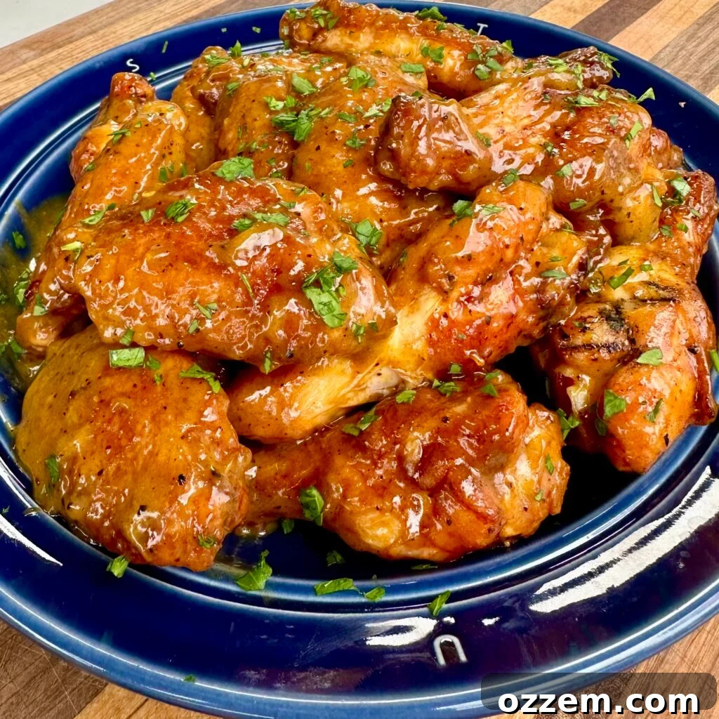 Grilled gochujang wings on a blue plate.