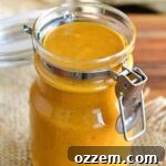 Carolina mustard BBQ sauce in a jar with the lid open.