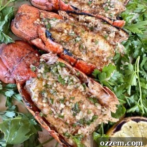 Platter of perfectly grilled prawns with lemon and garlic bread.