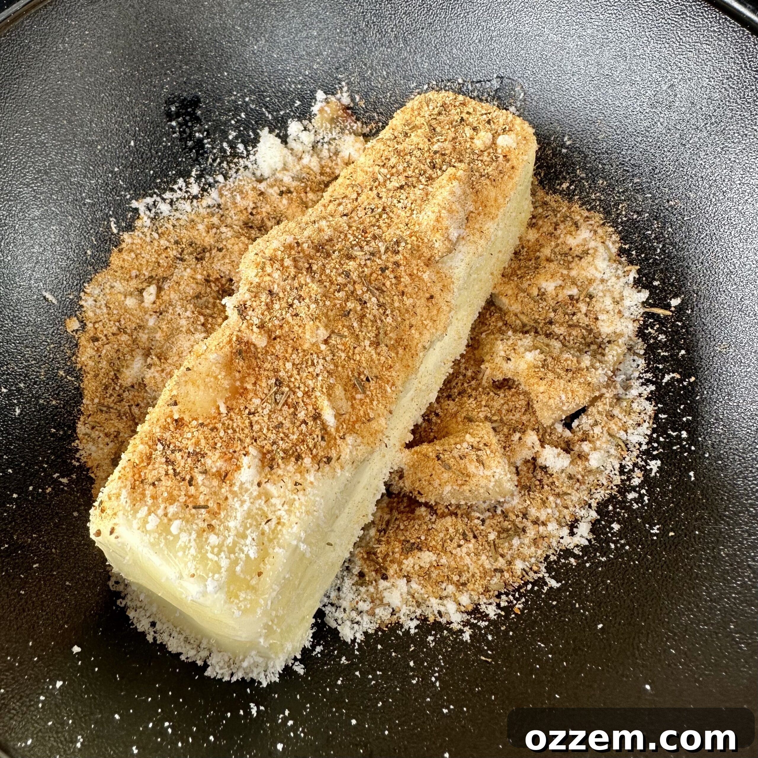 Homemade roasted garlic butter mixture in a bowl.