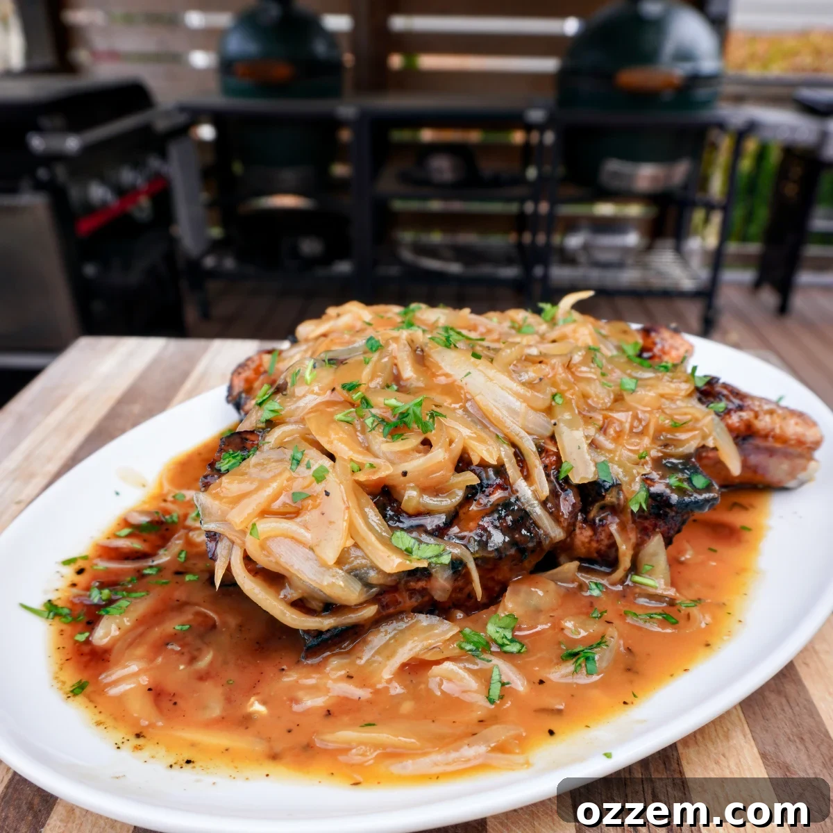 Succulent Pork Chops with Robust Beer Gravy 2 Perfectly seared beer brined pork chops smothered in rich onion gravy, garnished with fresh parsley.