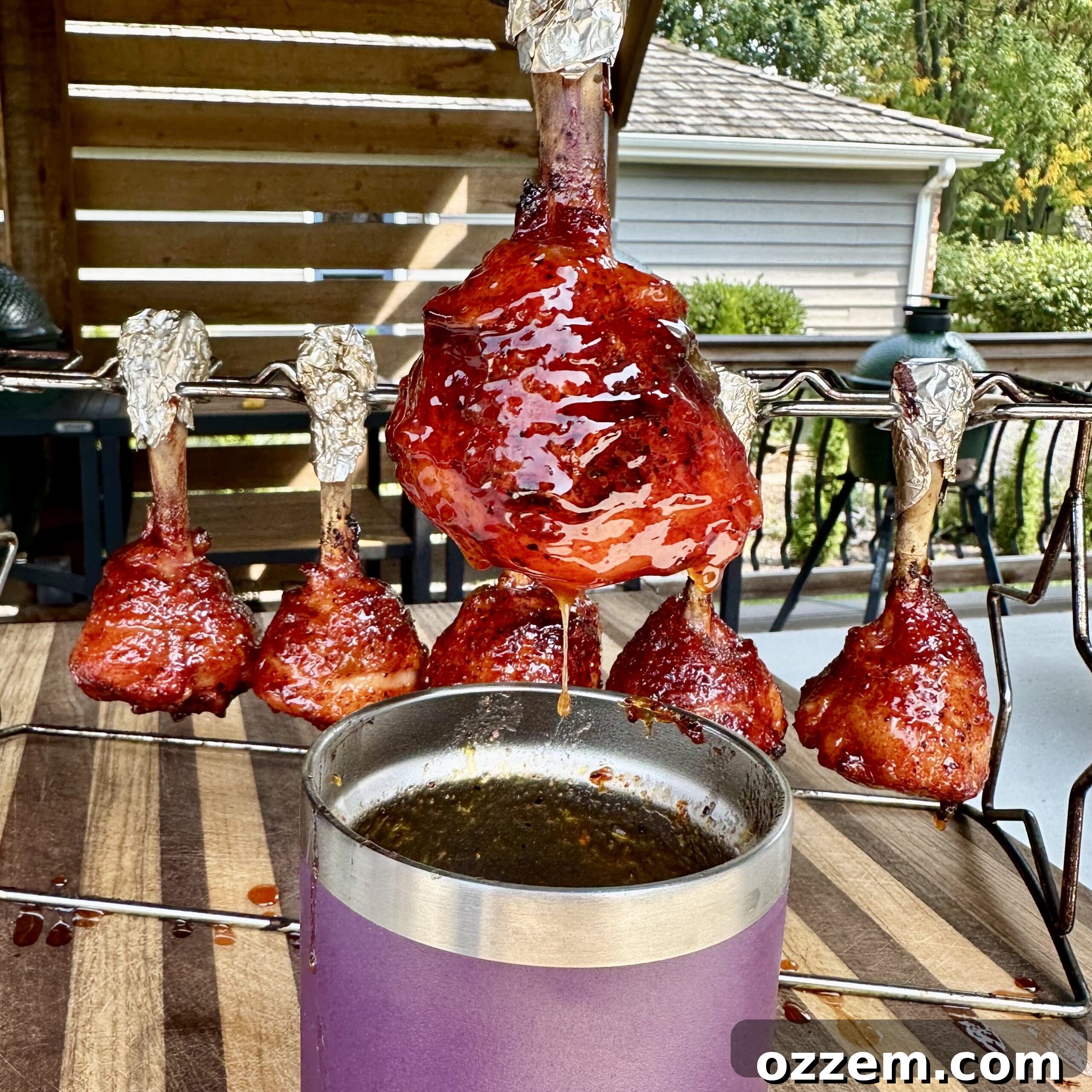 Bourbon Peach Chicken Lollipops 6 A saucepan filled with the simmering peach and whiskey sauce, showing its rich color and thick consistency.