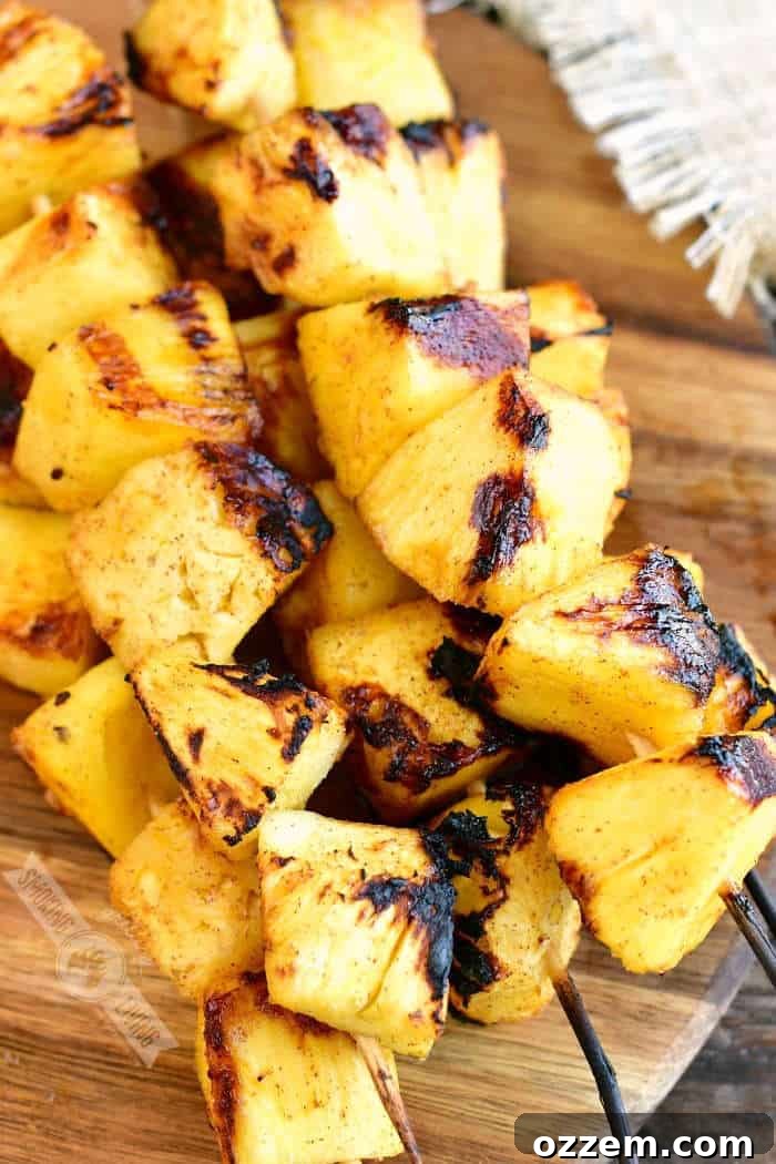 top view of grilled pineapple skewers on a cutting board