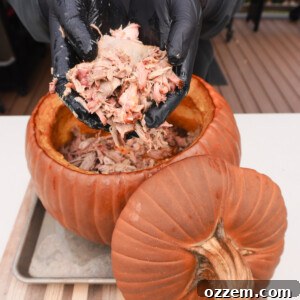 Shredded pumpkin pulled pork in a pumpkin