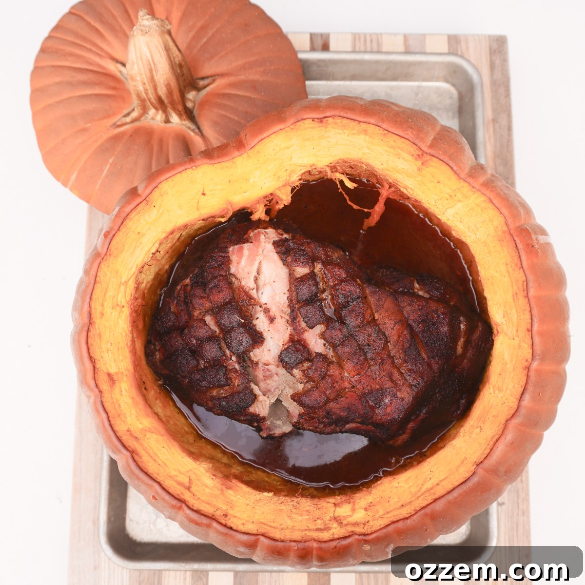 Pumpkin filled with pulled pork, juices, and spices