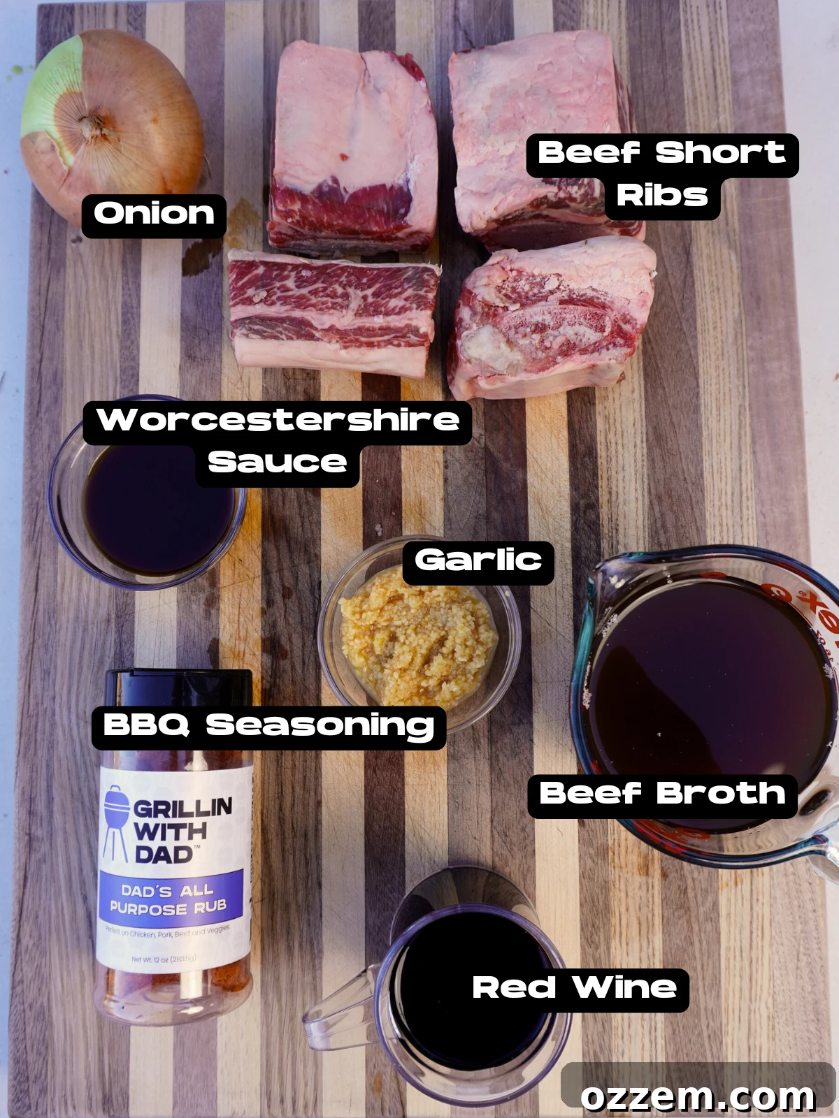 Velvet Smoke Ribs 3 A selection of fresh ingredients for smoked short ribs, including beef short ribs, onion, garlic, red wine, and beef broth.