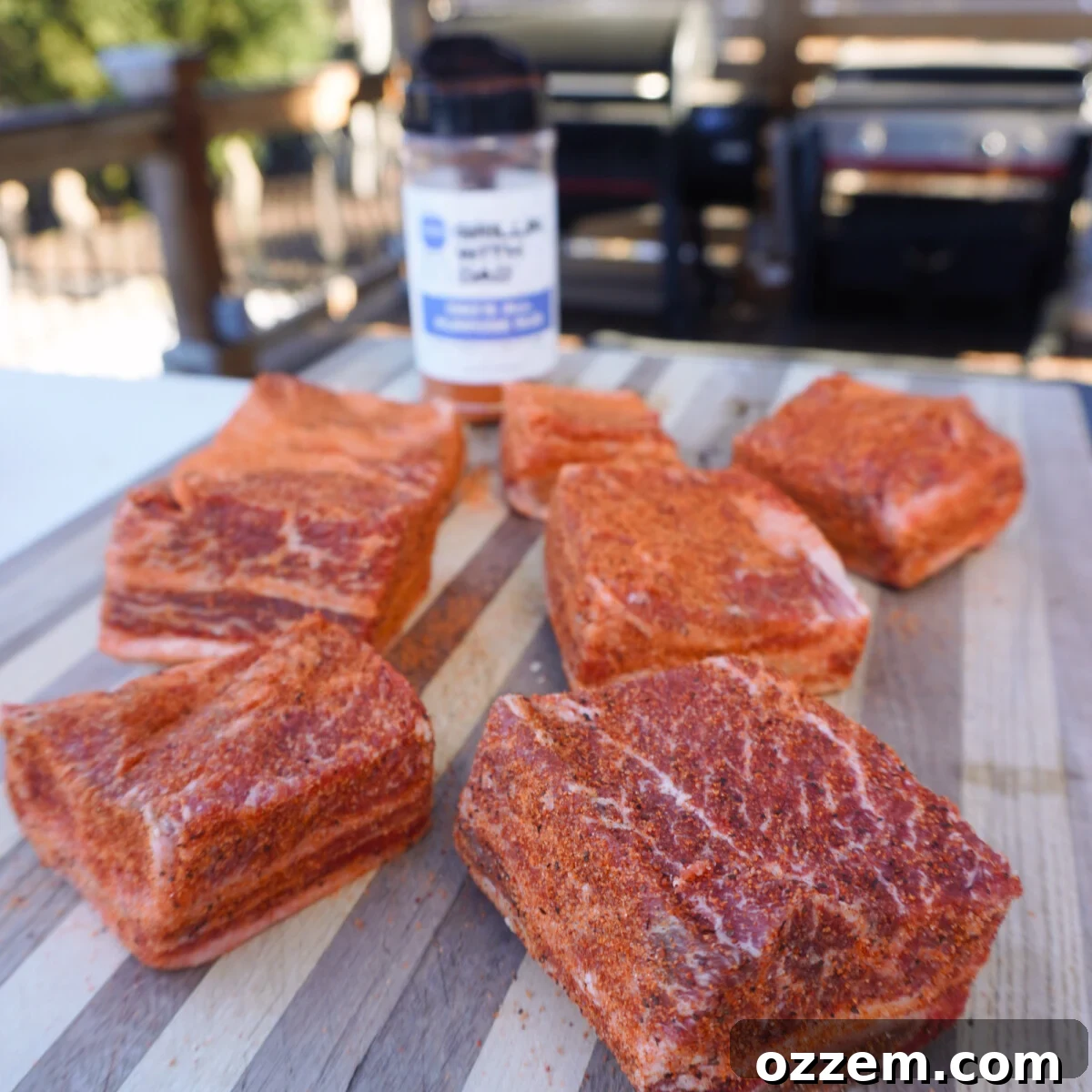 Velvet Smoke Ribs 6 Beautifully seasoned beef short ribs resting on a cutting board, ready for the smoker.