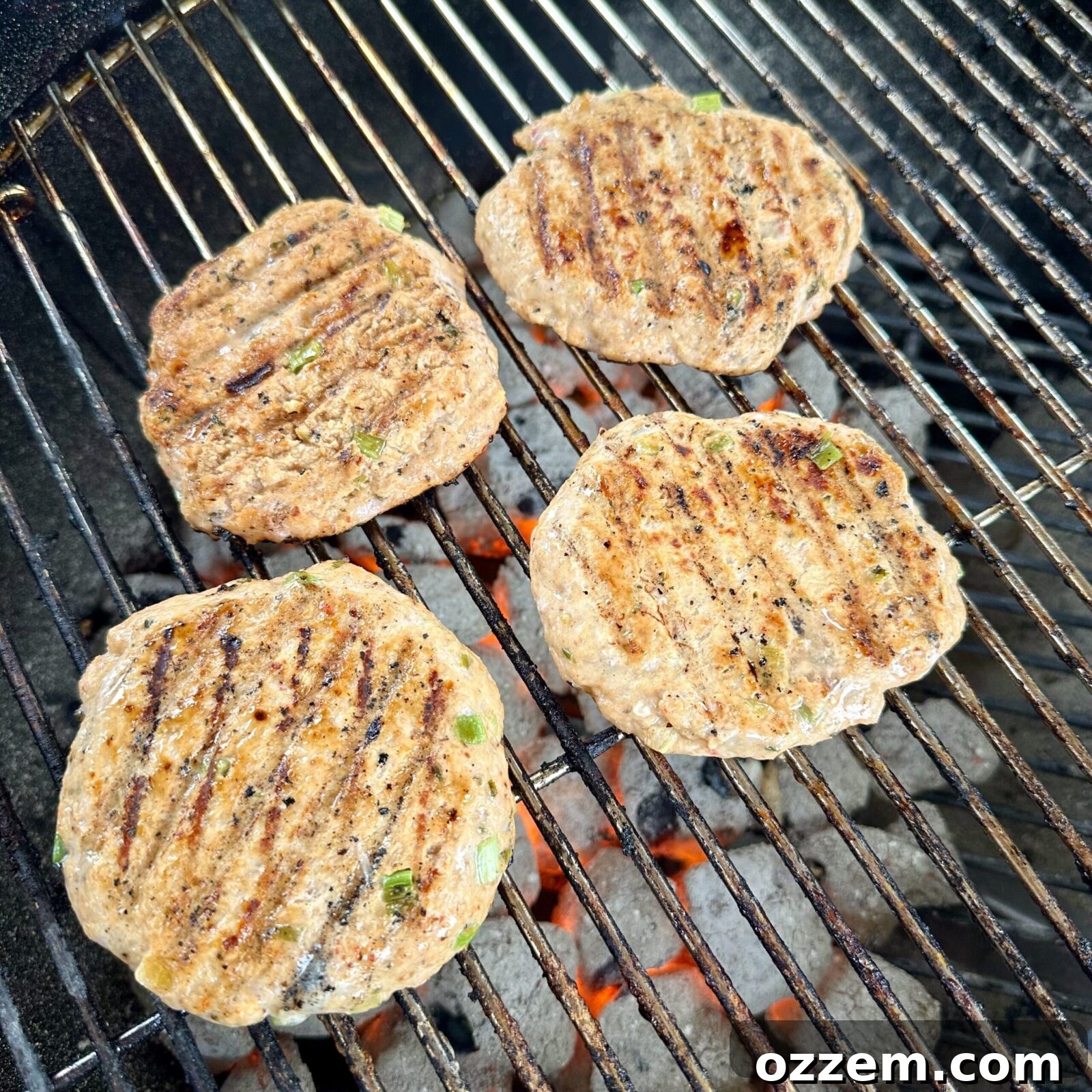 Beautifully grilled Thai inspired chicken burger, ready for assembly, with a slight char from the grill.