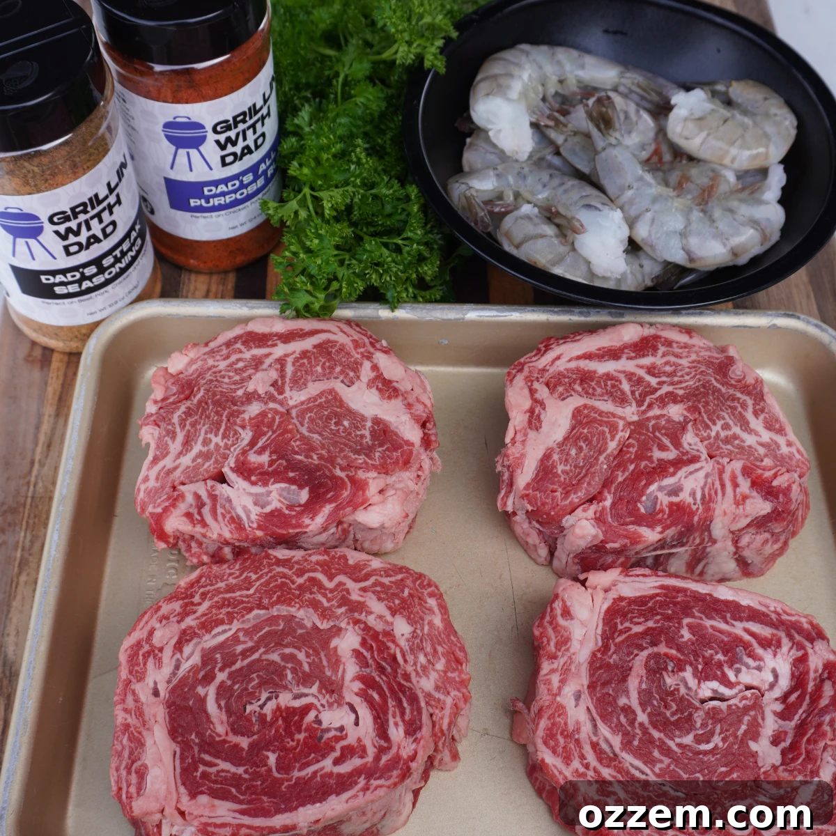 Capstone Surf & Turf 3 Unrolling and seasoning ribeye cap steak strips for enhanced flavor.