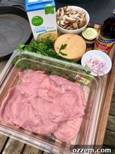 Grilled Veal Medallions in Marsala Sauce 2 Tender veal cutlets seasoned and ready for the grill, showcasing preparation for a delicious meal.