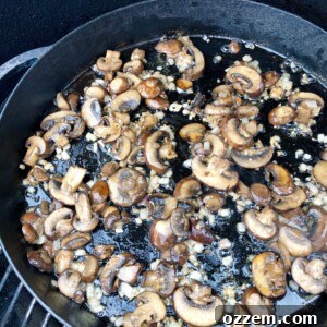 Grilled Veal Medallions in Marsala Sauce 5 Fresh cremini mushrooms, shallots, and garlic being sautéed in butter in a cast iron skillet, forming the aromatic base for the Marsala sauce.