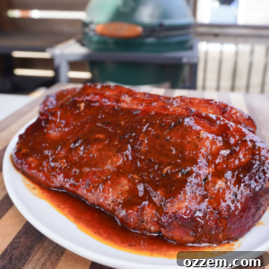 Smoked pork steaks, glazed with BBQ sauce and ready to serve.