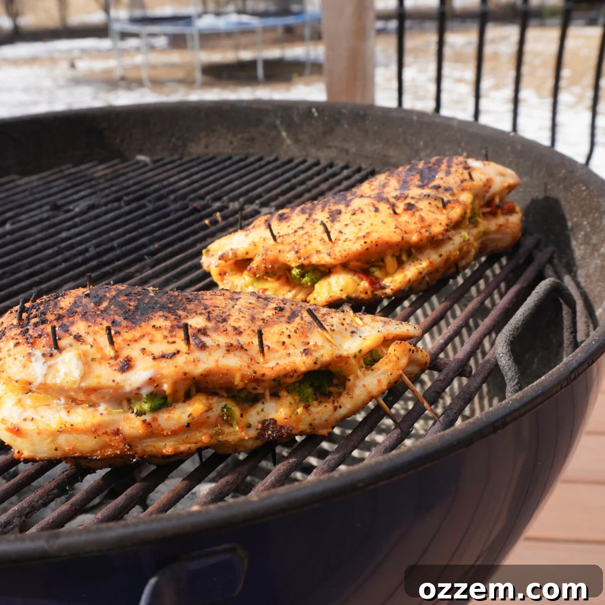 cheddar and broccoli stuffed chicken on the grill.