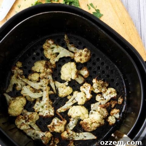 Crispy Air Fryer Cauliflower garnished with fresh herbs.