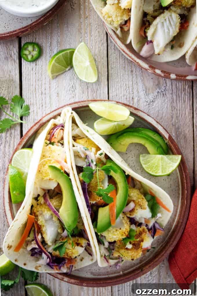 An overhead view of tilapia fish tacos on a plate.