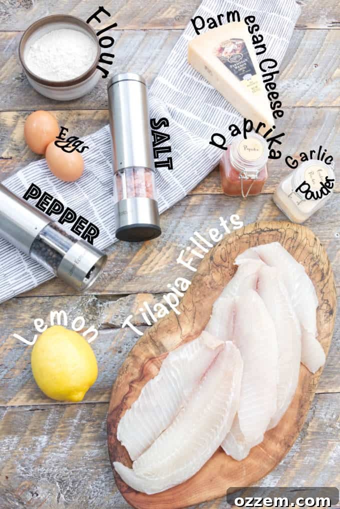 ingredients for tilapia fish tacos: tilapia fillets, lemon, garlic powder, paprika, parmesan cheese, eggs, flour, salt, pepper