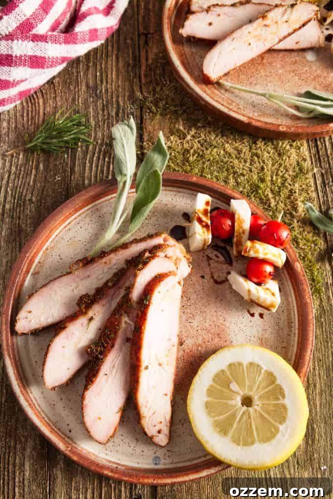 Hunter's Smoked Wild Turkey Breast 11 Artfully arranged slices of smoked wild turkey breast on a white plate, complemented by colorful caprese skewers and a delicate balsamic glaze drizzle, ready to be served.