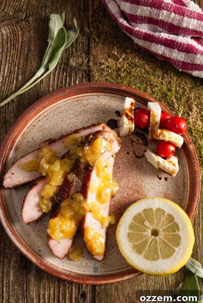 Hunter's Smoked Wild Turkey Breast 4 Generous slices of smoked wild turkey breast, beautifully arranged on a plate with vibrant caprese skewers and a delicate drizzle of balsamic glaze. The turkey itself is glistening with a flavorful orange lemon butter sauce.