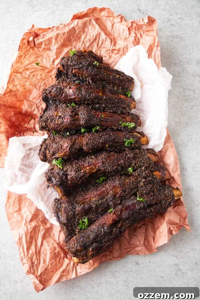 A glistening rack of Traeger smoked beef back ribs, coated in a savory dry rub, ready to be enjoyed.
