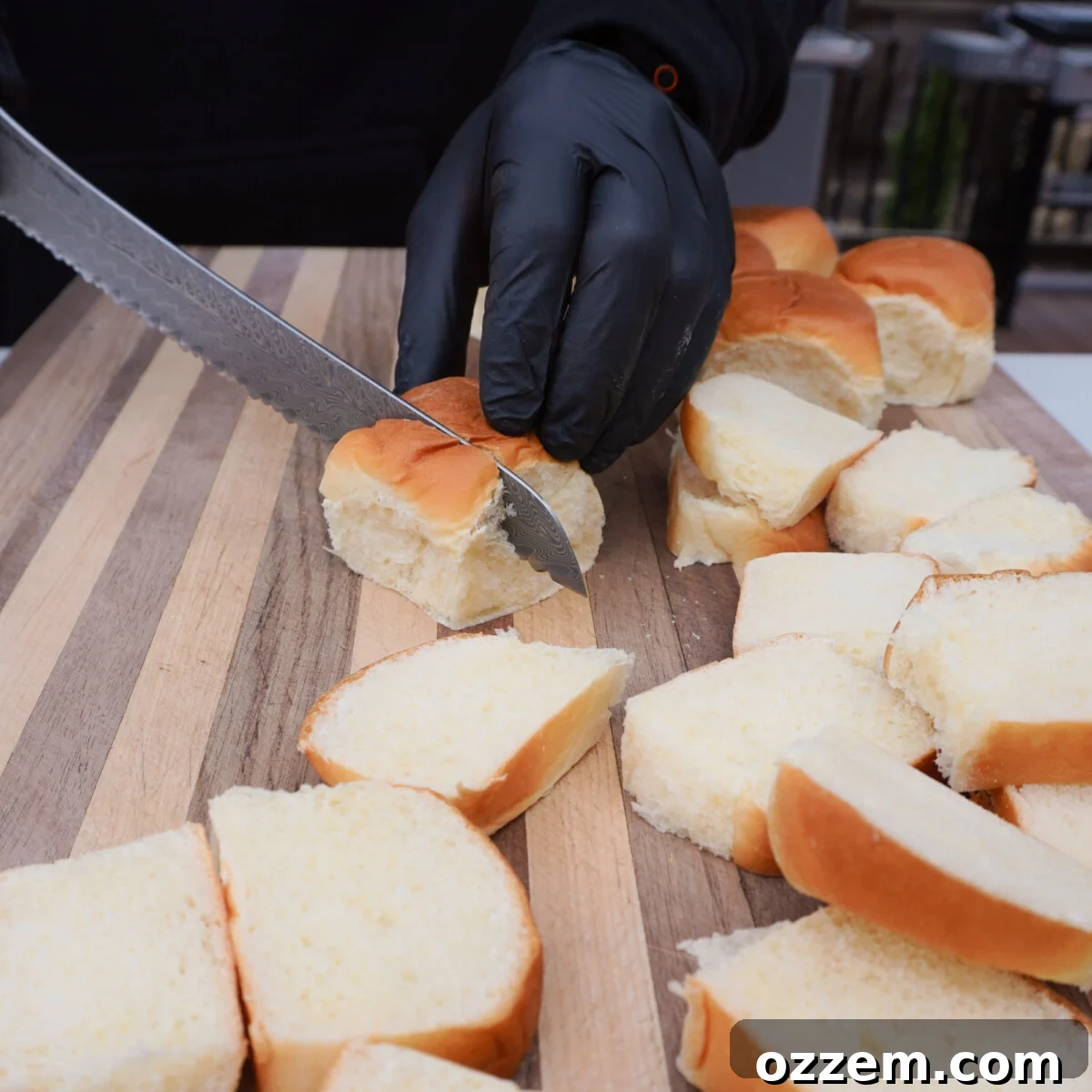 Slicing Kings Hawaiian rolls horizontally for an easy grilled French toast recipe.
