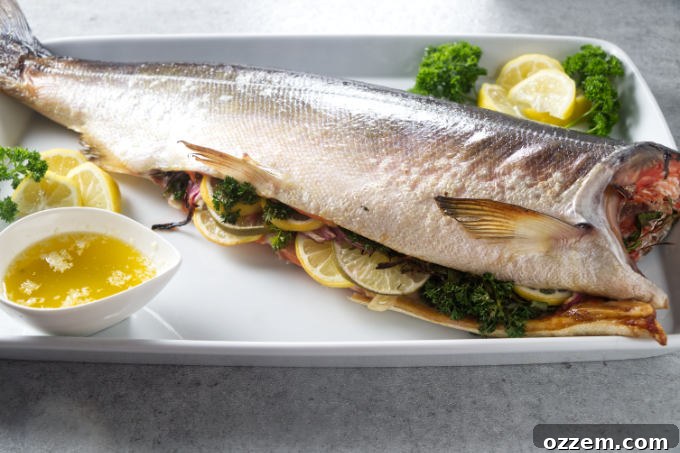 Grilled Whole Salmon Made Simple 3 Whole salmon stuffed with citrus and aromatics on serving platter