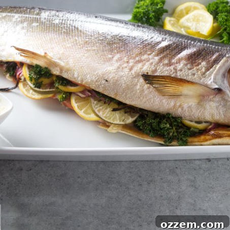 Grilled whole salmon on a platter.