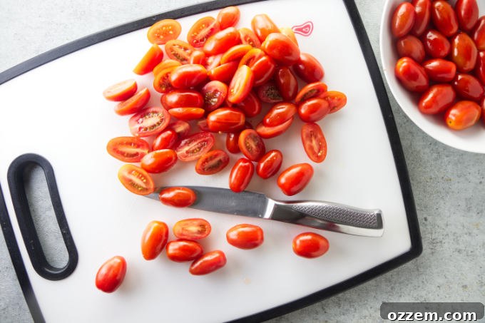 Slicing cherry tomatoes in half.