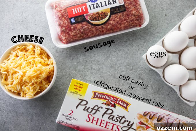A flat lay photograph showcasing the simple yet essential ingredients required to make homemade air fryer breakfast pockets: ground sausage, fresh eggs, shredded cheese, and a package of puff pastry dough.