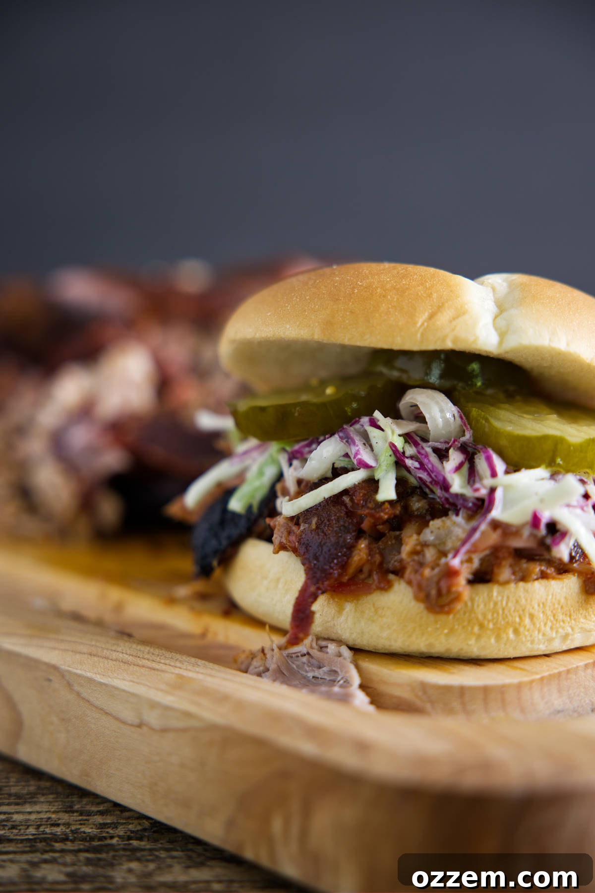 Pulled pork sandwich on butcher block.