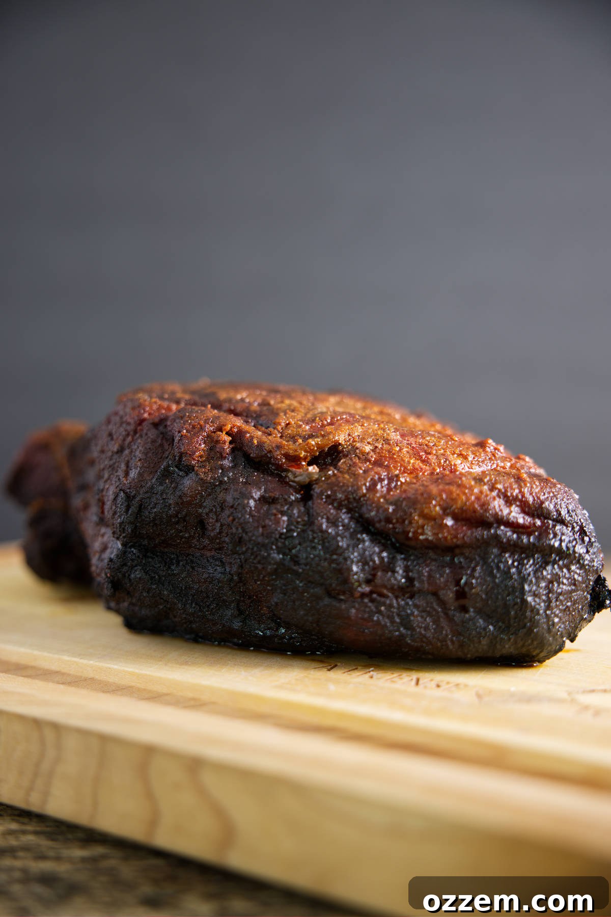 Smoked pork butt on butcher block.