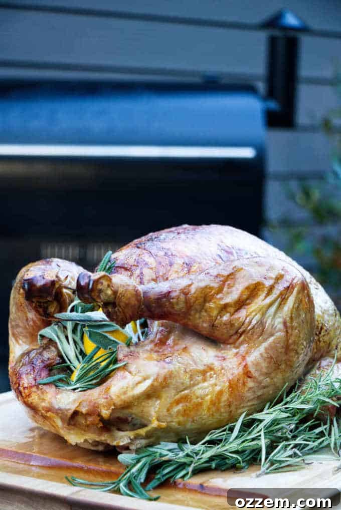 A perfectly juicy and flavorful turkey stuffed with herbs and citrus and resting on a cutting board, ready for carving.