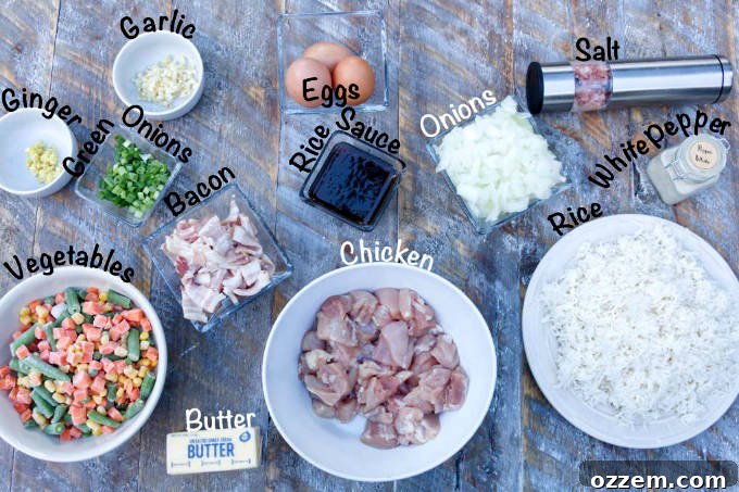 blackstone chicken fried rice ingredients: chicken, garlic, ginger, green onions, vegetables, bacon, egg, rice sauce, onions, salt, white pepper, rice
