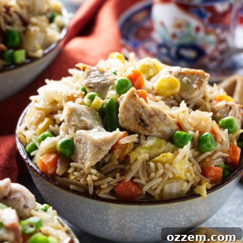 Chicken fried rice and some fortune cookies and tea cups.