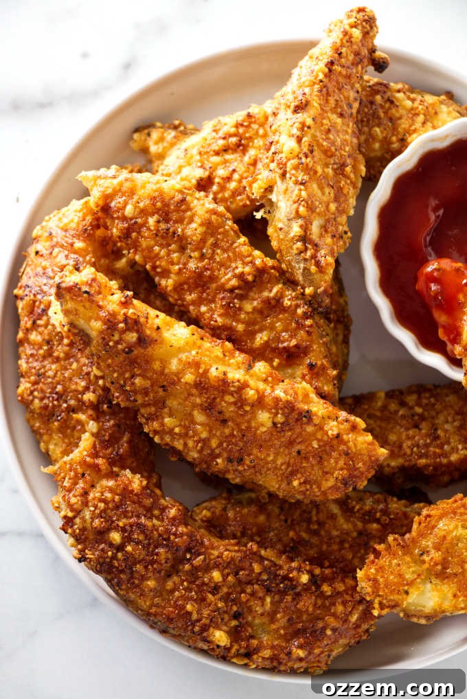 Crispy Cheesy Air Fryer Potato Wedges 2 overhead shot of airfryer potato wedges on a serving plate