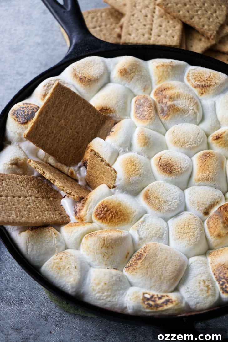 A cast iron skillet with s'mores dip.
