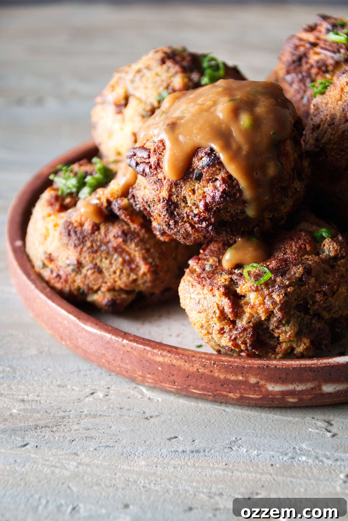 golden brown stuffing balls cooked in the air fryer with gravy on top
