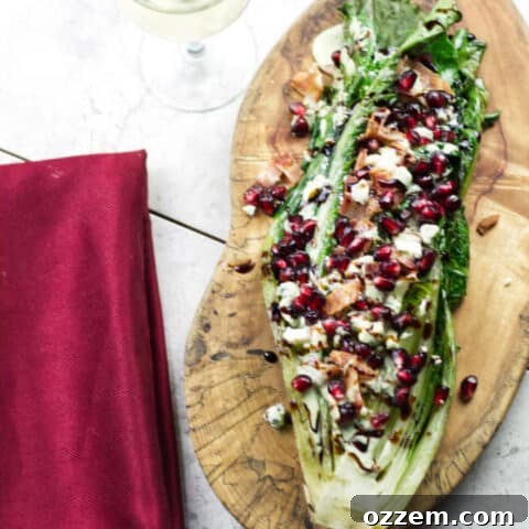 Grilled Romaine Salad with bacon, blue cheese, and pomegranate seeds.
