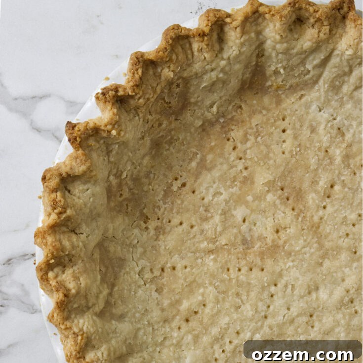 Blind baked Crisco pie crust in a pie plate.