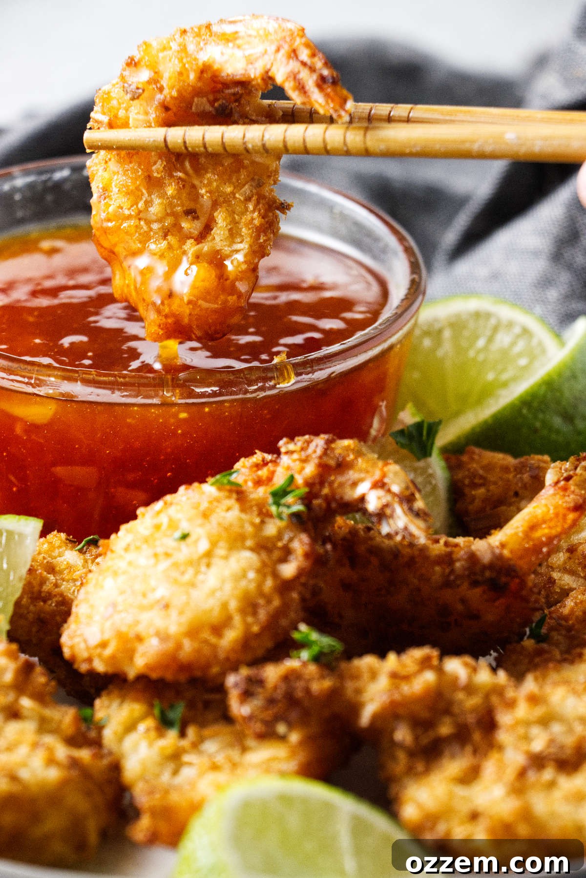 Crispy Air Fryer Frozen Coconut Shrimp 6 Dipping a shrimp in sweet chili sauce.